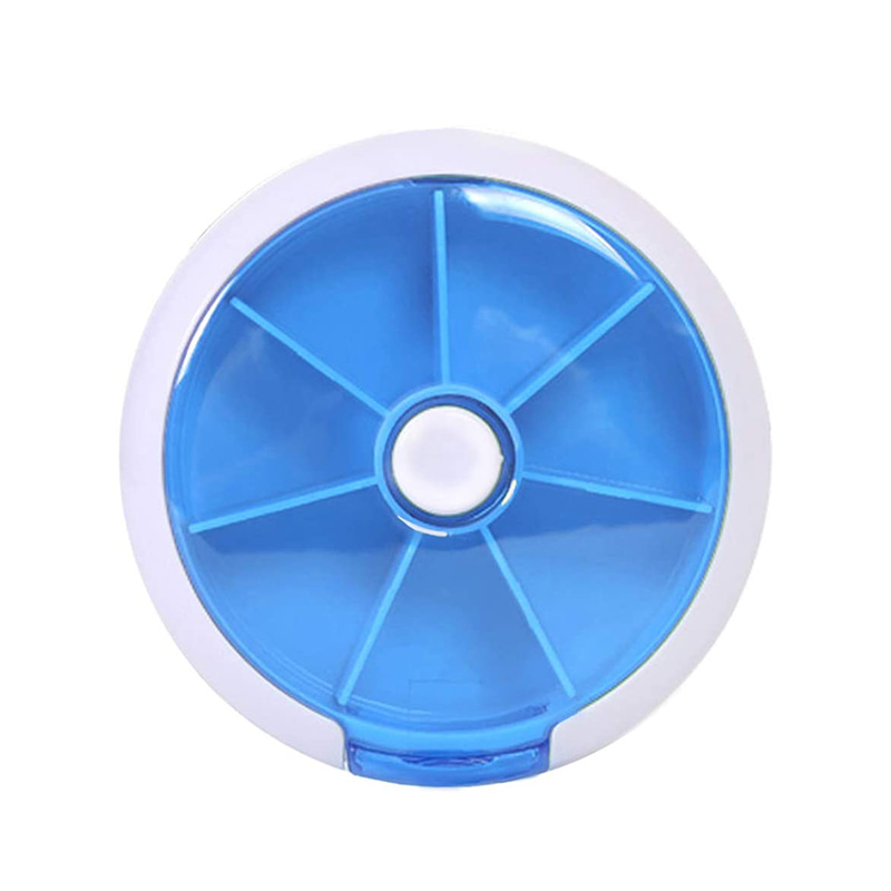 Painikkeella pyörivä viikoittainen pillerisuunnittelija, jossa on 7 lokeroa 